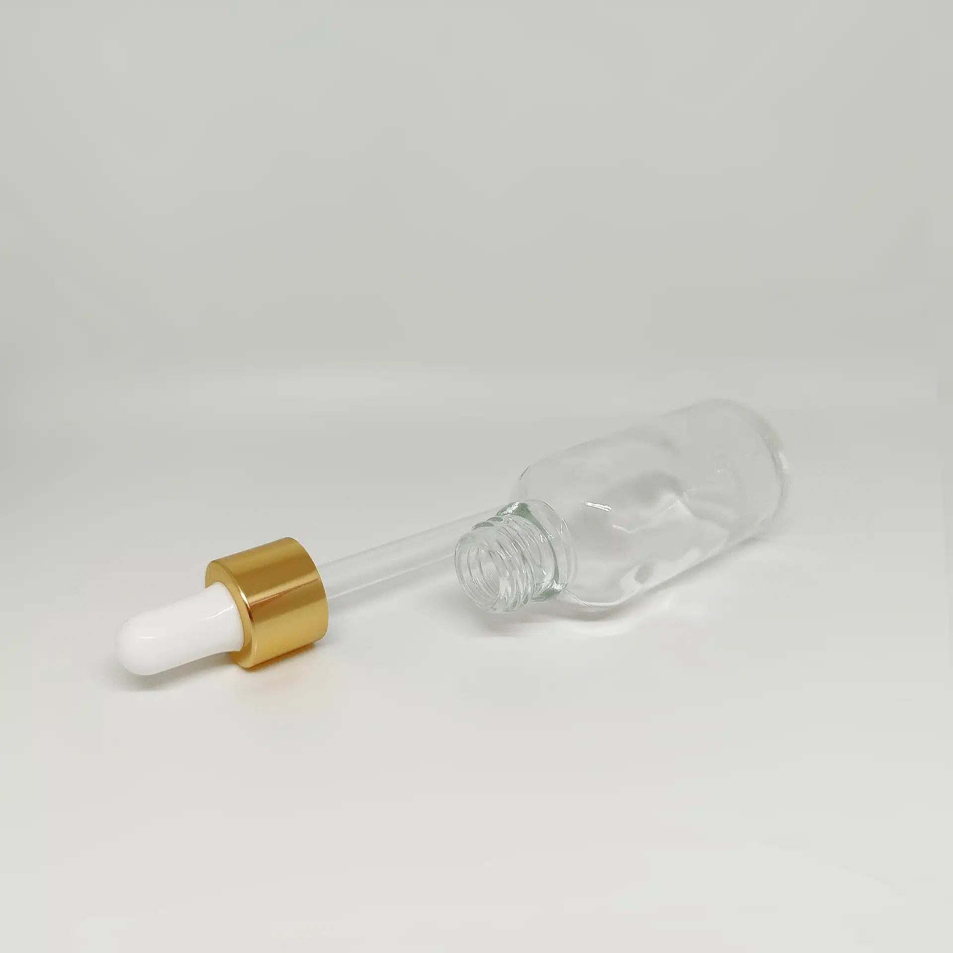 شیشه قطره ۳۰ شفاف با قطره چکان سفید طلایی وارداتی و میله قطره - Image 3